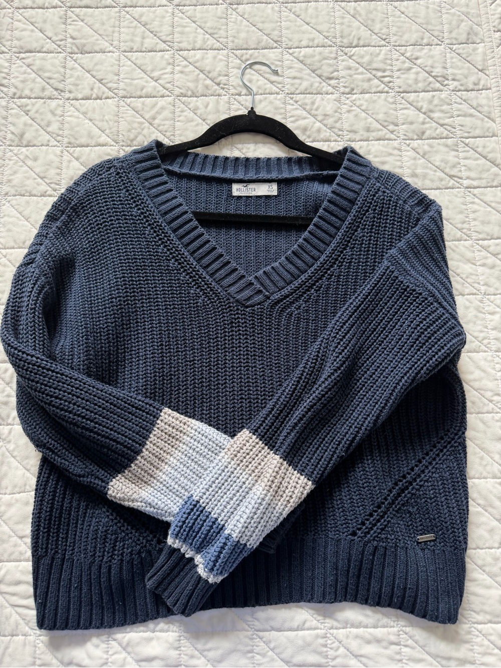 Hollister Navy V‑Neck Knit Sweater with White and Light Blue Sleeve Stripes